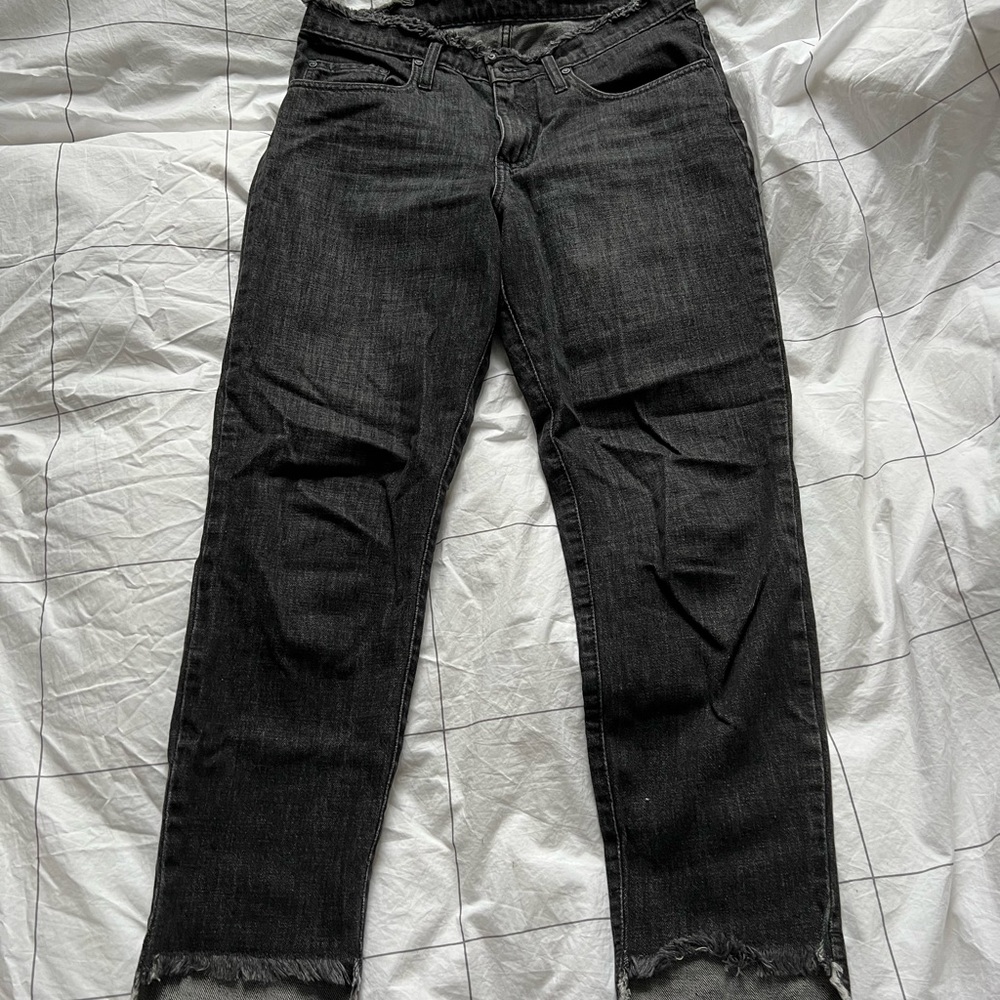 Gray jeans with frayed bottoms and waist